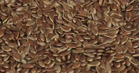Flax seeds closeup rotating selective focus Stock Footage 156861444