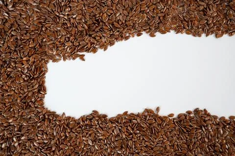 Flax Seeds with Empty Space on White Background Stock Photos