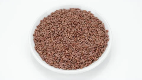 Flax seeds isolated on white background, rotate. 4K UHD video Stock Footage 155191224