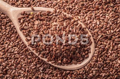 Flax Seeds Linseed On Wooden Spoon