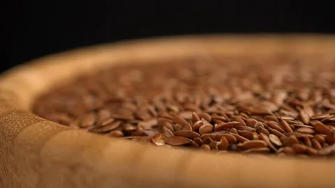 Flax seeds rotating background Stock Footage 100407939
