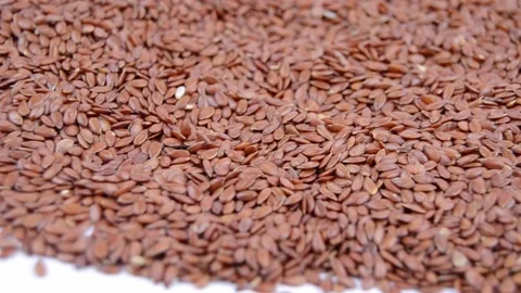 Flax seeds on white background, close up. Agriculture for oil Stock Footage 172365924