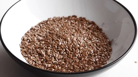 Flax seeds on white background Stock Footage 89483627