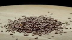 https://images.pond5.com/flax-seeds-wooden-board-footage-117315531_iconm.jpeg