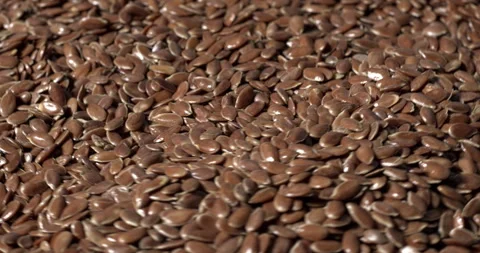 Flaxseed as a background. Close-up view of linseed, table spin. Stock Footage 278239513