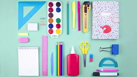 Flay lay top view layout of school supplies on the table. Pastel colors. Stock Footage 282239189