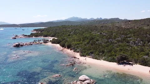 Flaying over a wild sand beach of emerald coast in Sardinia, Italy Stock Footage 137870419