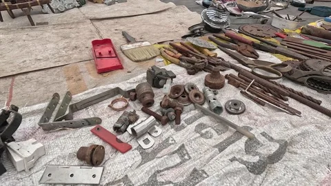 Flea Market Display of Rusted Hand Tools, Screws, Brackets and Workshop Stock Footage 346416654