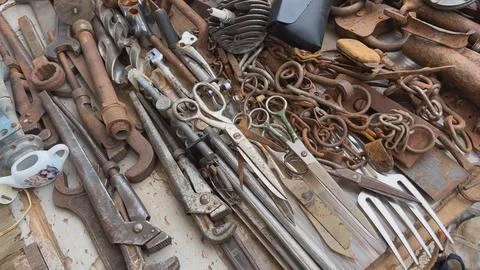 A flea market of old rusty things and tools. Photos