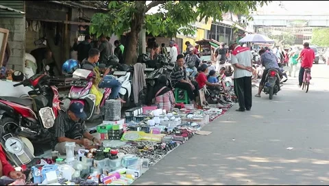 Flea market traders lining on the Pasar turi in Surabaya Stock Footage 302072796