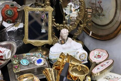 Flea shelf with decorations, mirrors, figures and other objects Stock Photos