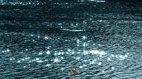 Flecks of sunlight sparkle in fast moving water current. 스톡 동영상 53429914