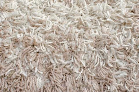Fleecy fluffy carpet, background, texture. Stock Photos