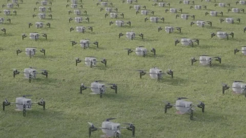 A Fleet of Drones on Grass Ready To Fly 4K Log Footage Stock Footage 289000026