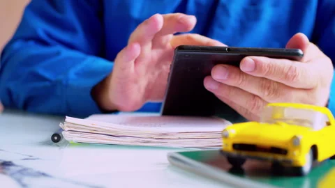 Fleet manager analyzing logistics data on digital tablet Stock Footage 337672076