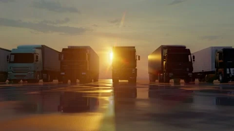 Fleet of trucks with semi-trailers against the backdrop of the sun's rays. Stock Footage 237178462