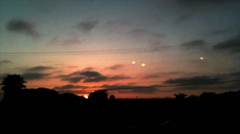 A Fleet of UFOs Over a Sunset Landscape 스톡 동영상 42004379