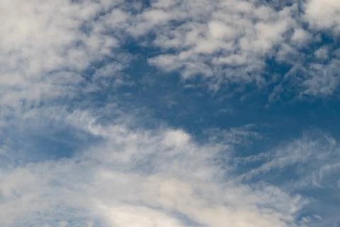 Fleeting cloud formations in sky. Temporary cloud shapes moving across high.. 写真素材