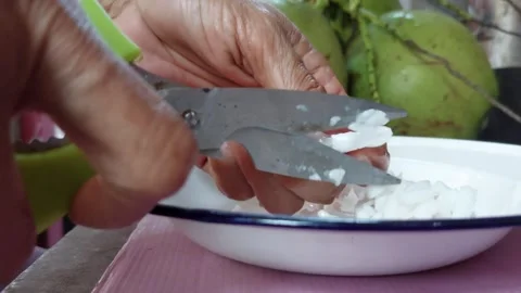 The flesh of the white coconut is cut Stock Footage 261131278
