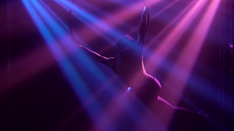 The flexible athletic circus gymnast performs acrobatic elements on the air ring Stock Footage 138868807