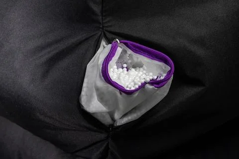 Flexible bean bag inside. Frameless chair filled with polystyrene balls. Mo.. Stock Photos