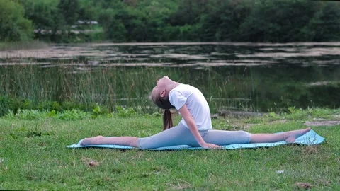 A flexible child, doing gymnastics exercises. Stock Footage 239465322