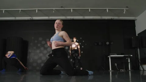 Flexible dancers Dance studio contemporary girls routine Stock Footage 305104547