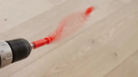Flexible Drill Brush In Action. Spinning Red Drill Brush Cleaning Hardwood Stock Footage 330395855