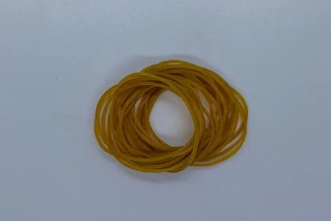 Flexible Elastic Rubber Bands Bundle for Office Use on Plain Surface Stock Photos