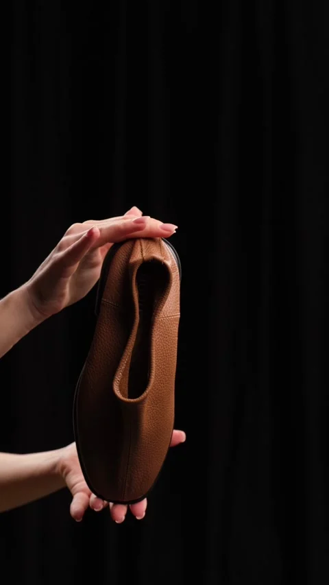 Flexible Leather Loafer in Hands Stock Footage 303774041