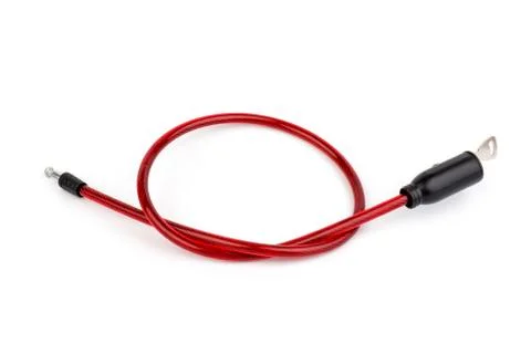 Flexible red bicycle cable with key on white background.  Security and safety Stock Photos