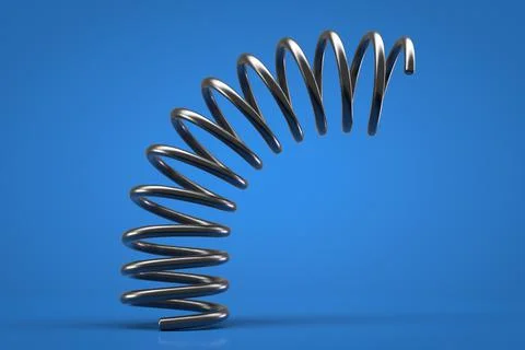 Flexible ring spring close up. Blue background. Foto stock