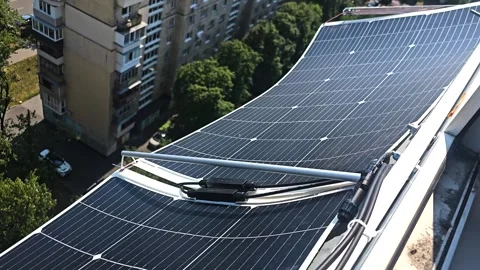 Flexible Solar Panels Installed on Apartment Balcony for Urban Renewable Energy Stock Footage 340777441