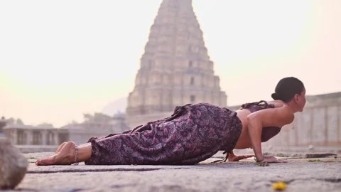 Flexible woman doing complex asanas Stock Footage 264085474