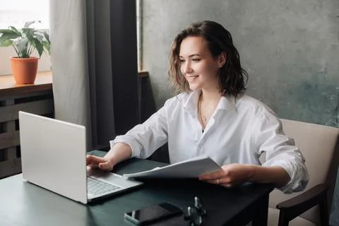 Flexible Work and Study: Young Woman Using Laptop at Office and Student Gir.. Stock-Fotos