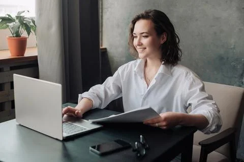 Flexible Work and Study: Young Woman Using Laptop at Office and Student Gir.. Stock Photos