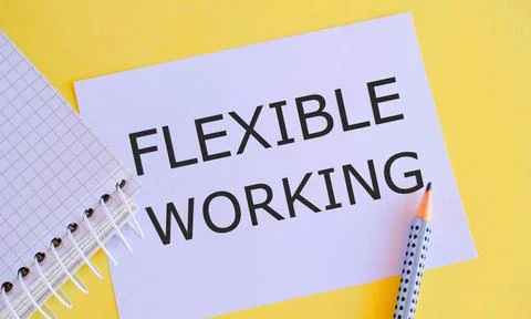 FLEXIBLE WORKING text written on white paper on yellow background. Concept of Stock Photos