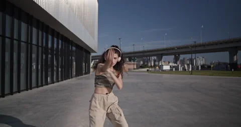Flexible young dancer performing in city Stock Footage 209569412