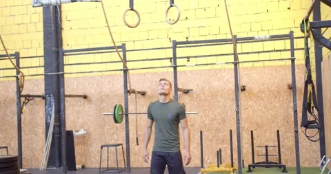 Flexing and after that he is doing pull ups Stock Footage 157665388