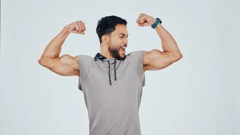 Flexing, muscles and man in studio for fitness, bodybuilding or strength workout Stock Photos