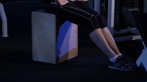 Flexion of the feets in a sitting position.An older woman practicing joint Video stock 115511634