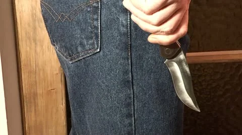 Flick-knife in the hands of a criminal weapon Stock Footage 21287971