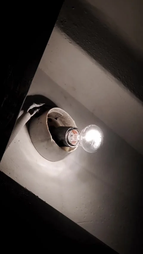 Flickering Bare Light Bulb In Old Broken Socket Stock Footage 325224085