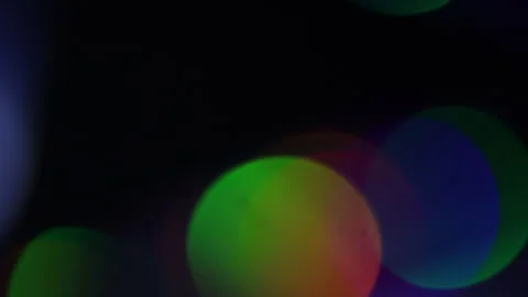 Flickering bokeh light with different colors in the dark 스톡 동영상 309452763