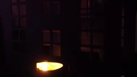 A flickering candle casts eerie shadows in a dark castle on Halloween night Stock Footage 319744463
