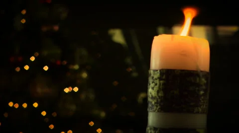 Flickering Candle with Christmas lights LOOP Video stock 58026441