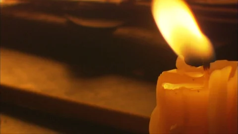 Flickering Candle on Historical tabletop Stock Footage 91392957