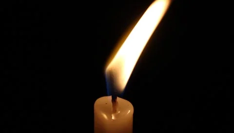 Flickering candle with melting wax Stock Footage 5166178