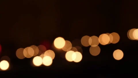 Flickering candlelight  out of focus  blurred as bokeh in a dark old house. Stock Footage 135350727