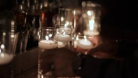 Flickering Candles Set Tranquil Mood, Tiered Glass Candle Holders Emit Soft Stock Footage 323771126